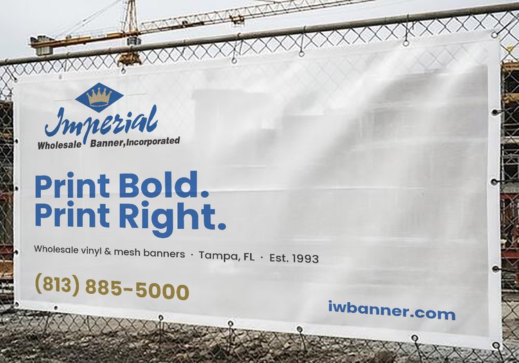 Imperial 8 oz. mesh banner installed on a chain-link construction fence — Tampa, FL